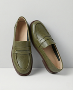 Stylish burgundy loafers with a classic heritage design, featuring a sleek silhouette and comfortable fit. 0
