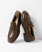 Stylish burgundy loafers with a classic heritage design, featuring a sleek silhouette and comfortable fit. 2