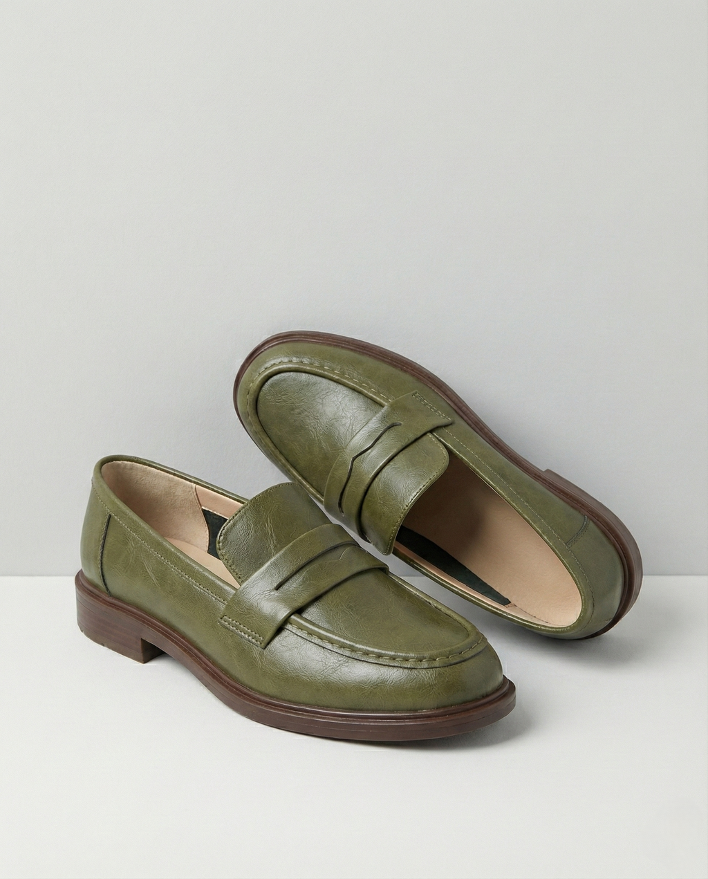 Stylish burgundy loafers with a classic heritage design, featuring a sleek silhouette and comfortable fit. 4