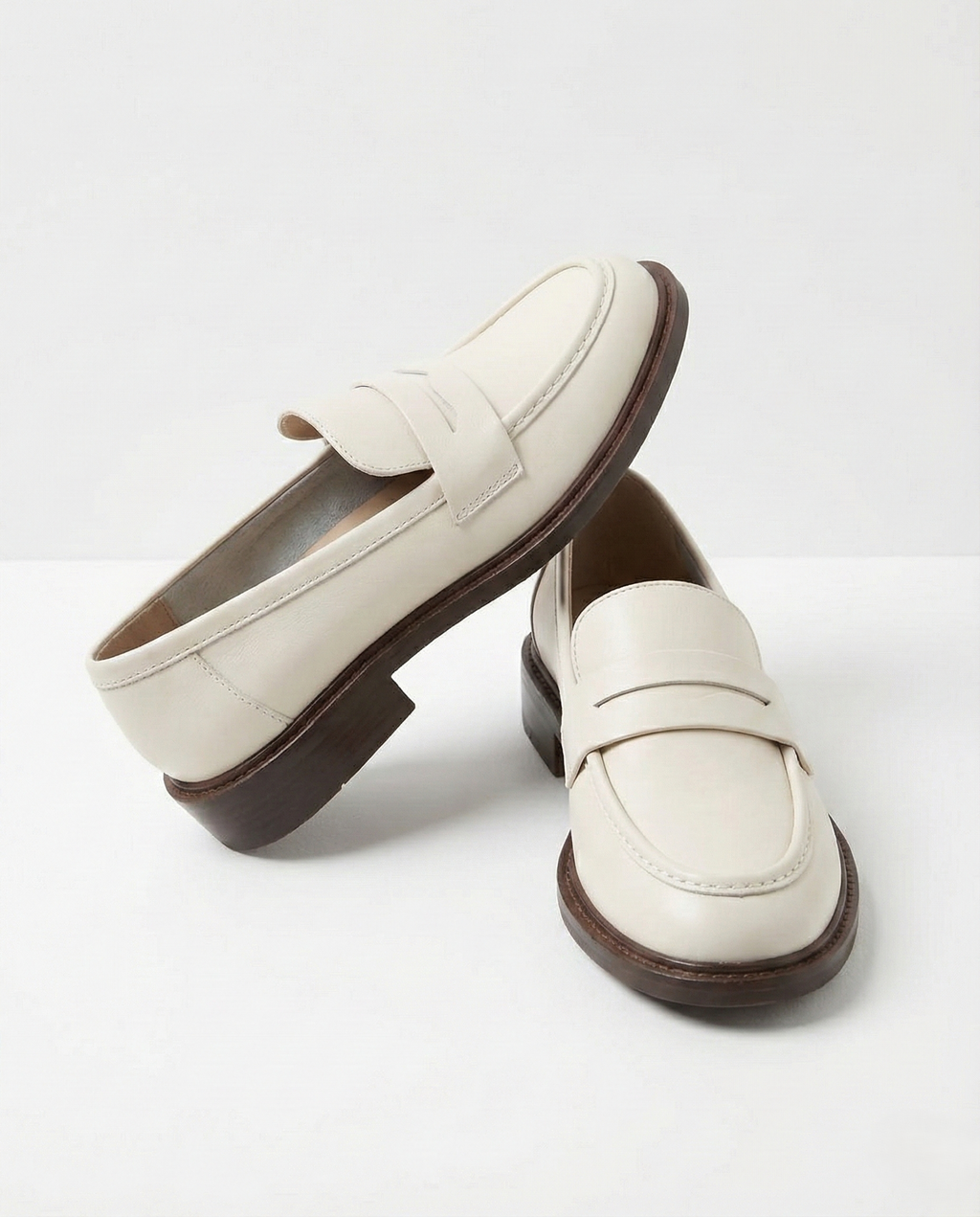 Stylish burgundy loafers with a classic heritage design, featuring a sleek silhouette and comfortable fit. 7