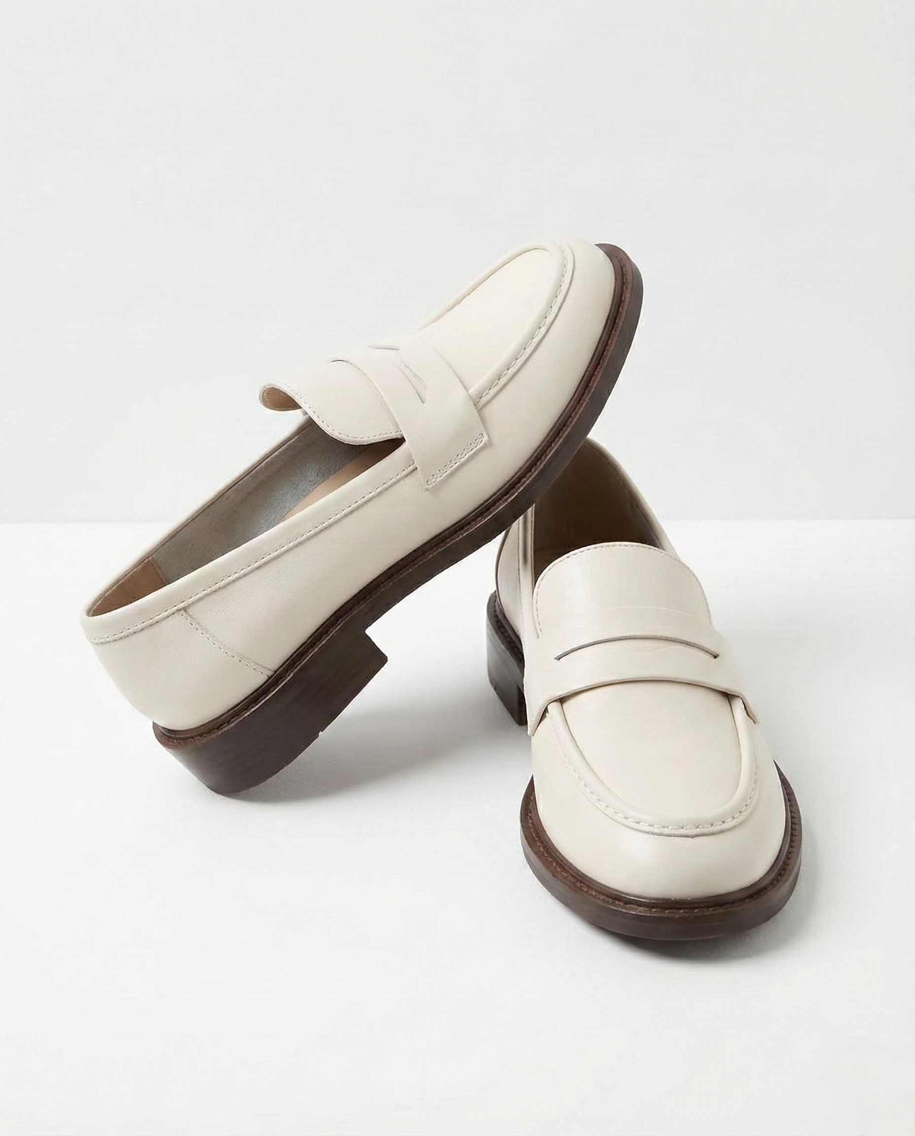 Stylish burgundy loafers with a classic heritage design, featuring a sleek silhouette and comfortable fit. 7