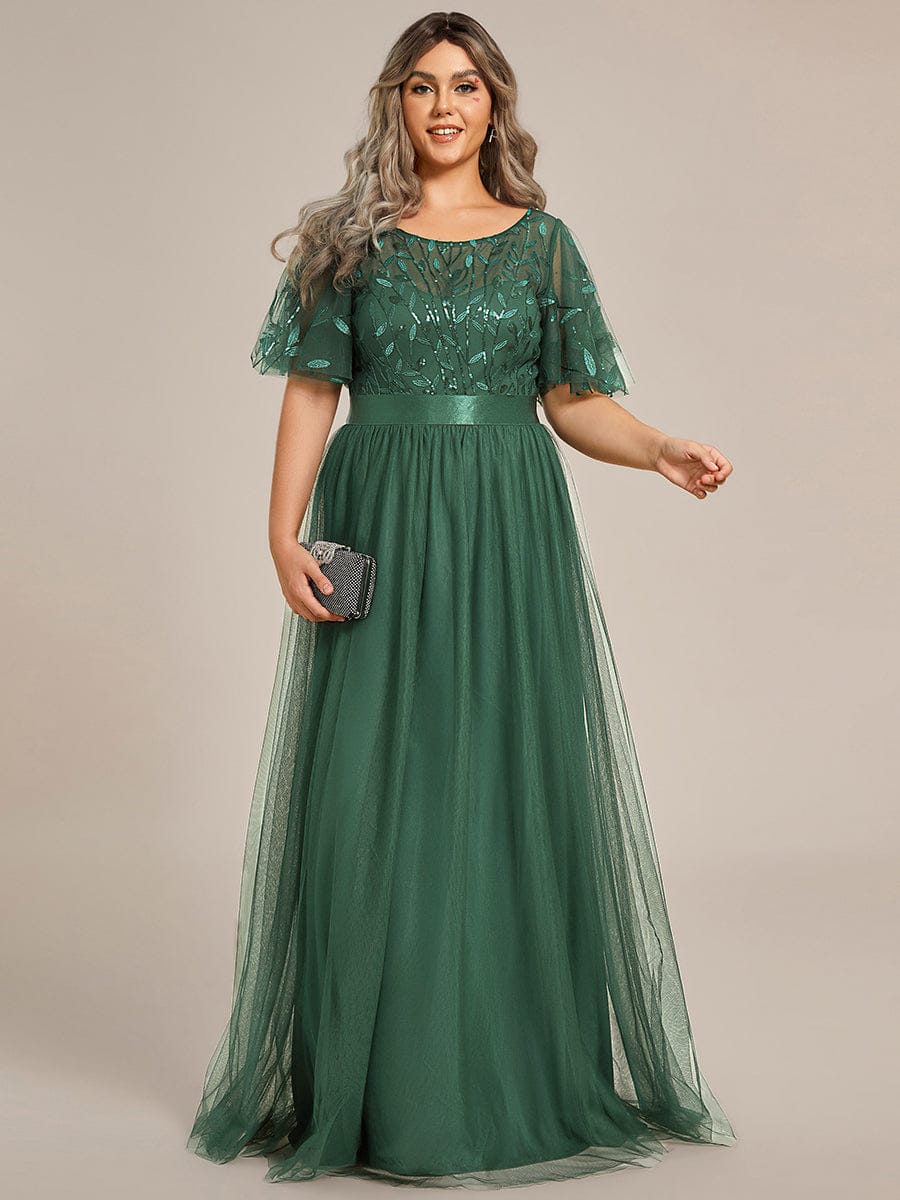 Eucalyptus green plus size gown with a sequinned leaf bodice, satin waistband and tulle skirt.
