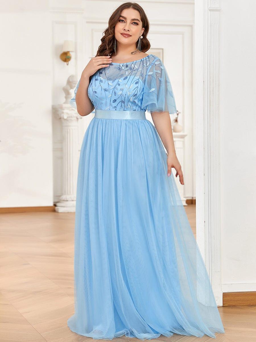 Plus size gown with a sequinned leaf bodice, satin waistband and full tulle skirt.