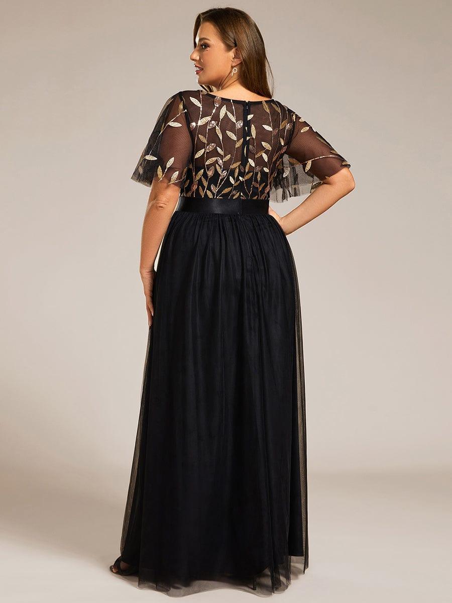 Plus size gown with a sequinned leaf bodice, satin waistband and full tulle skirt.