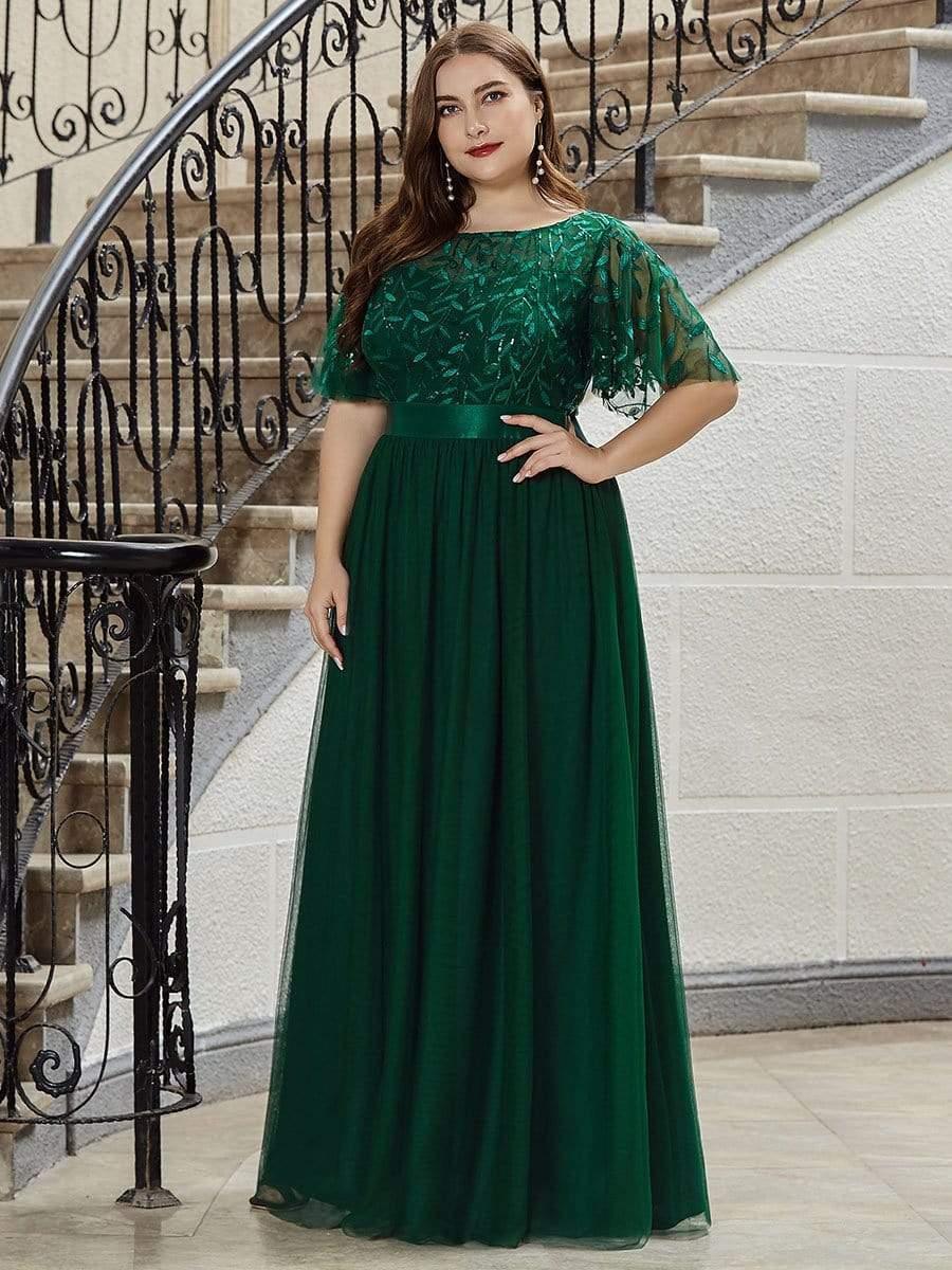 Plus size gown with a sequinned leaf bodice, satin waistband and full tulle skirt.
