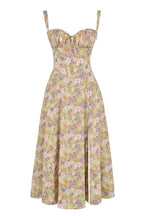 Floral print midi dress in soft pastel colors with a fitted bustier bodice, featuring a flowing skirt. 10