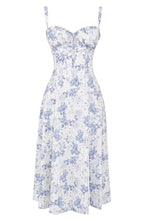 Floral print midi dress in soft pastel colors with a fitted bustier bodice, featuring a flowing skirt. 13