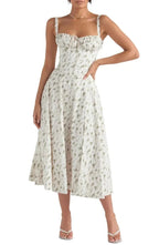 Floral print midi dress in soft pastel colors with a fitted bustier bodice, featuring a flowing skirt. 3