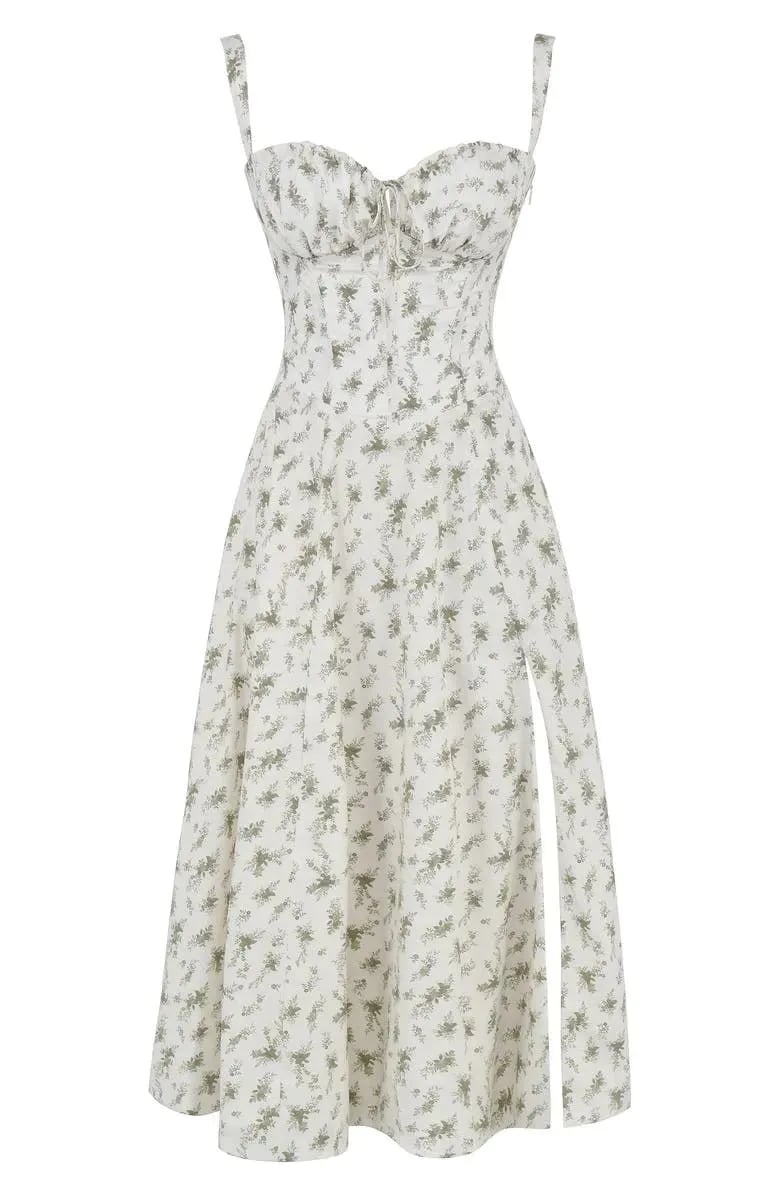 Floral print midi dress in soft pastel colors with a fitted bustier bodice, featuring a flowing skirt. 4