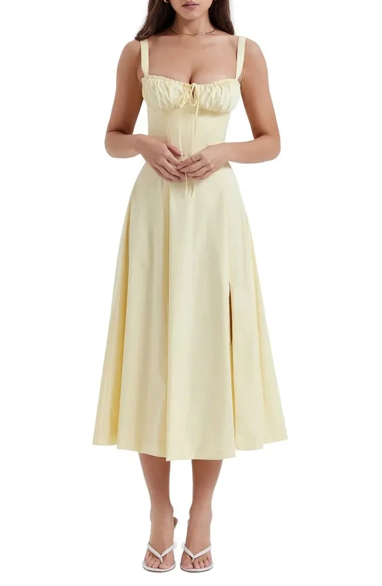 Floral print midi dress in soft pastel colors with a fitted bustier bodice, featuring a flowing skirt. 5