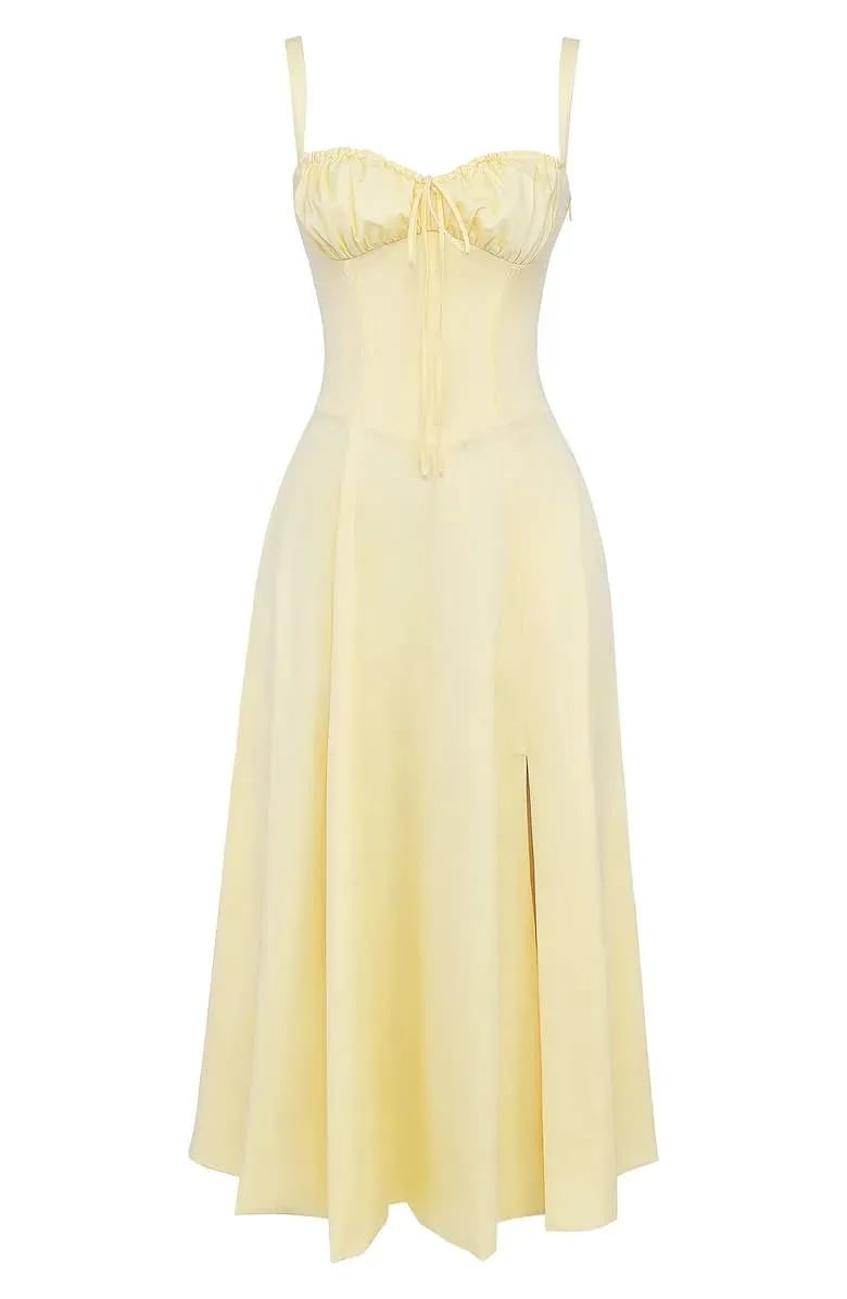 Floral print midi dress in soft pastel colors with a fitted bustier bodice, featuring a flowing skirt. 7