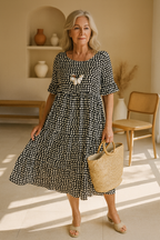 Light blue midi dress with short sleeves and a relaxed fit, featuring a simple, casual style. 2