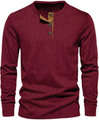 Burgundy men's long sleeve henley top with a three-button placket.