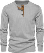 Light grey men's long sleeve henley top with a three-button placket.