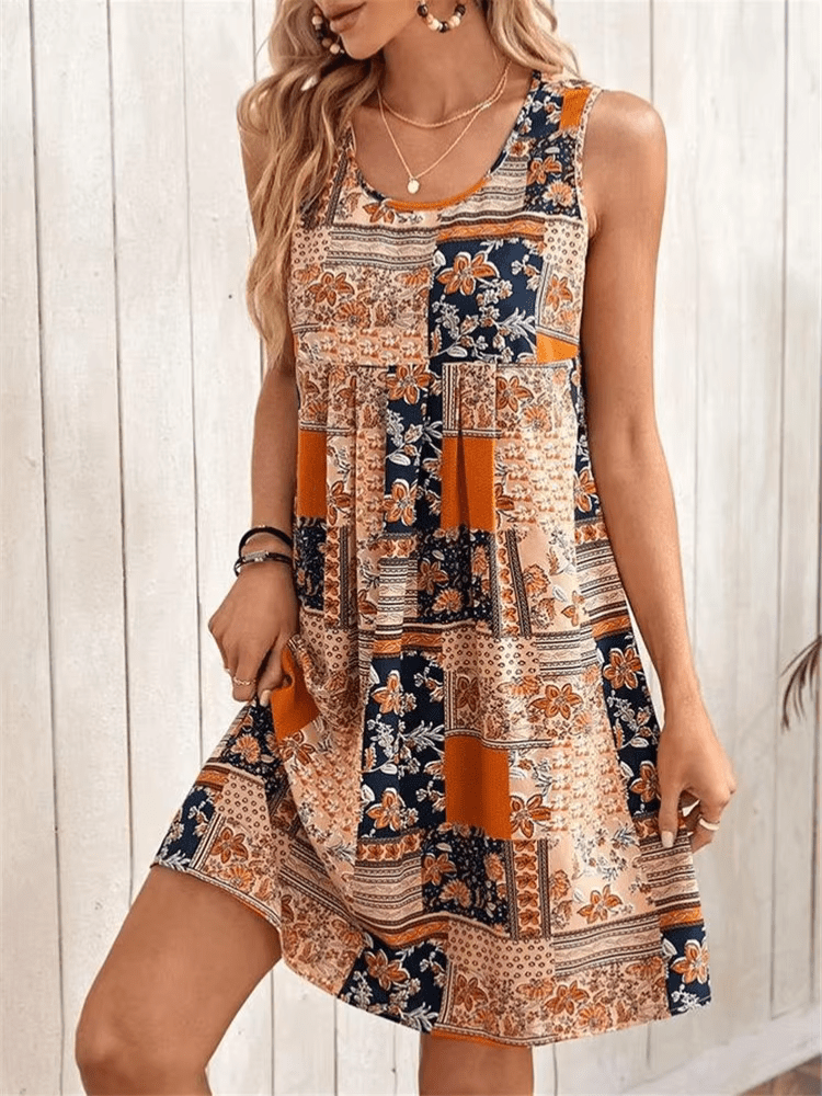 A flowing, floral-patterned dress in soft pastel colors with a relaxed boho style, perfect for summer days. 0