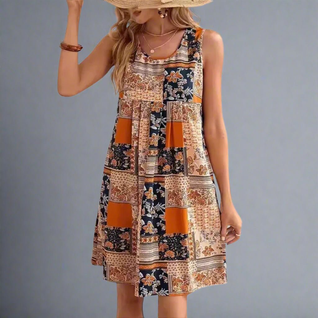 A flowing, floral-patterned dress in soft pastel colors with a relaxed boho style, perfect for summer days. 1