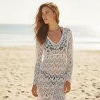 Light blue crochet beach cover-up with long sleeves and a scoop neckline, featuring a relaxed and breezy style. 1