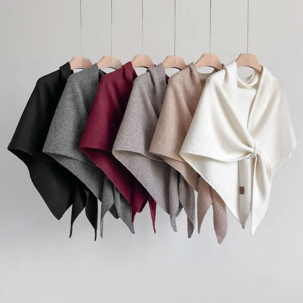 Sterre knitted triangle shawl, all six colours on a rail