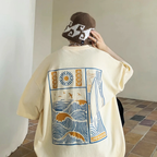 Oversized t-shirt in a warm sunset gradient, featuring a relaxed fit and soft fabric for casual wear. 1