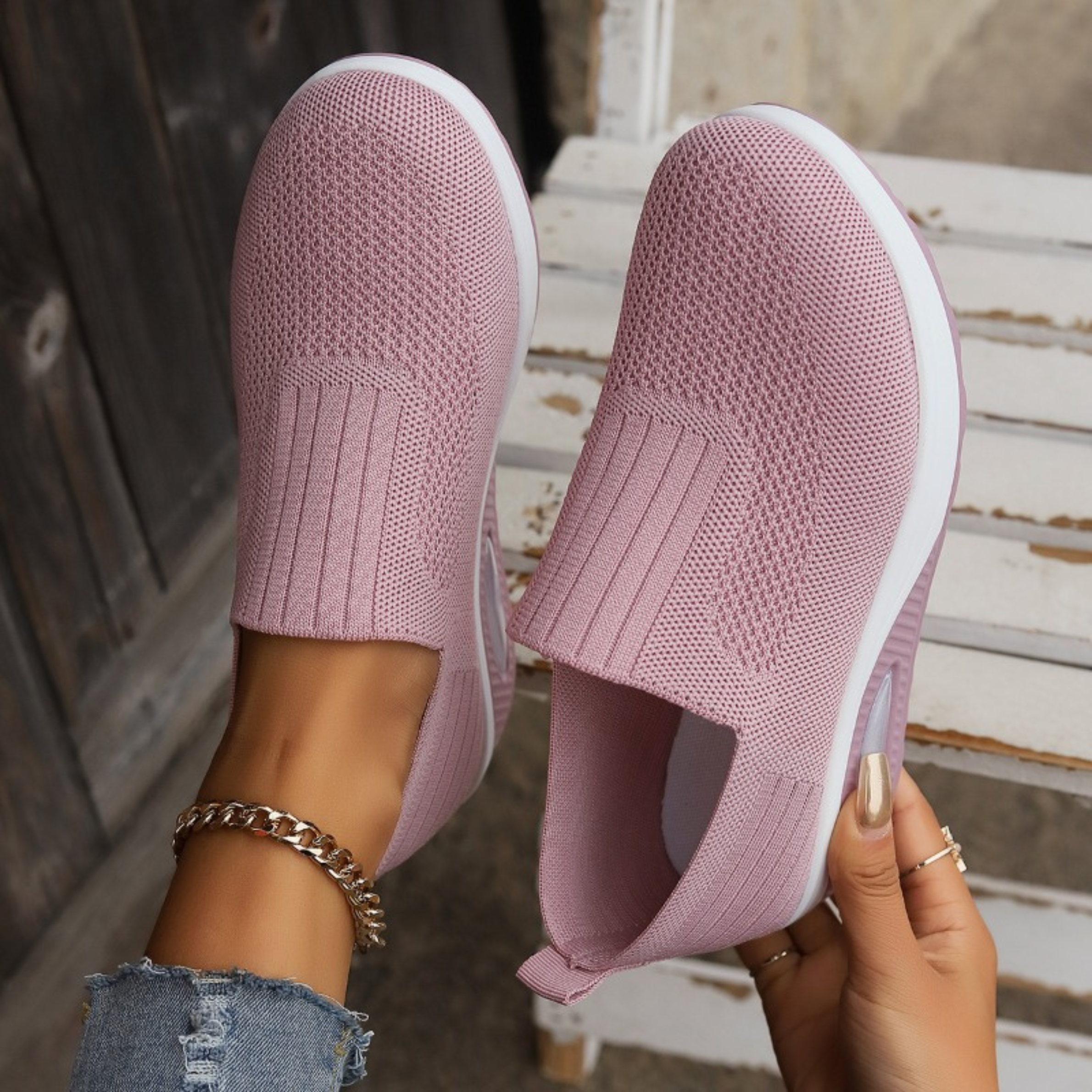 Knitted slip-on sneakers for women with a cushioned wedge sole.