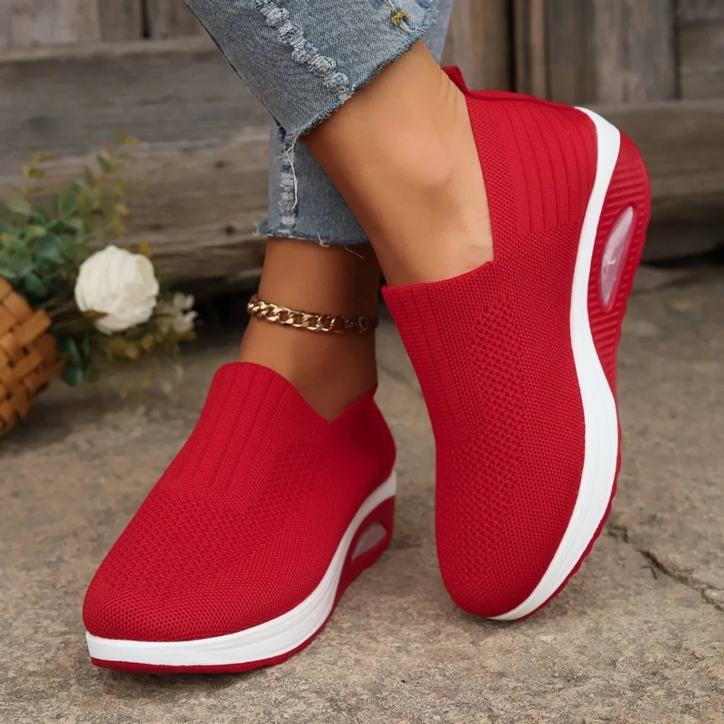 Knitted slip-on sneakers for women with a cushioned wedge sole.