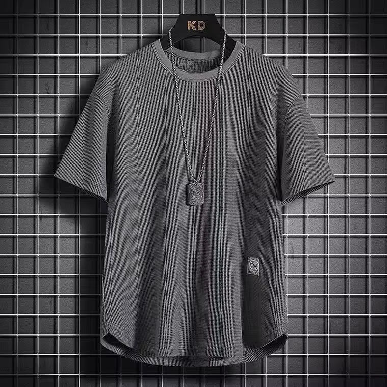 A navy blue waffle-knit men's shirt with a casual style and long sleeves. 0