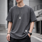 A navy blue waffle-knit men's shirt with a casual style and long sleeves. 1