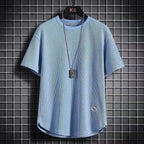A navy blue waffle-knit men's shirt with a casual style and long sleeves. 2