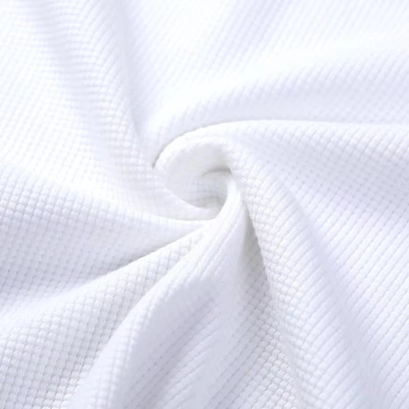 A navy blue waffle-knit men's shirt with a casual style and long sleeves. 6