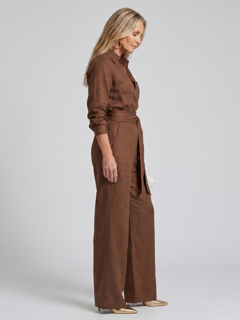 Black long-sleeve jumpsuit with a wide-leg design, offering a modern and comfortable fit for women. 2