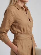 Black long-sleeve jumpsuit with a wide-leg design, offering a modern and comfortable fit for women. 7