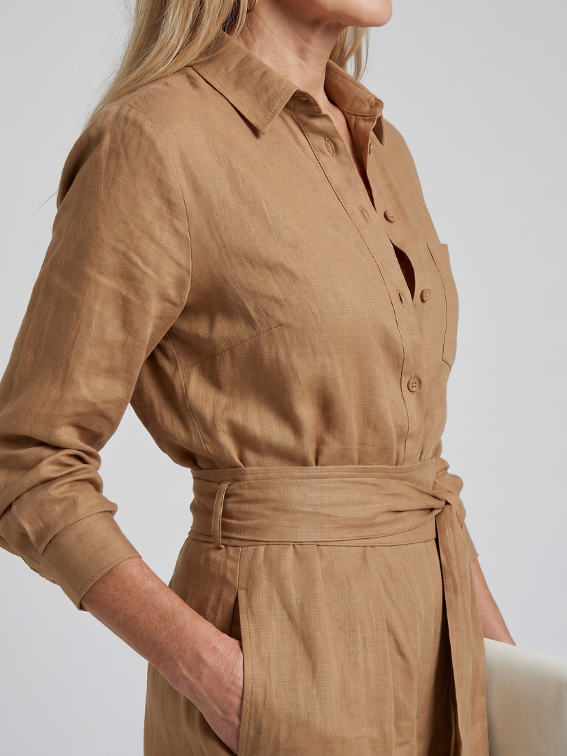 Black long-sleeve jumpsuit with a wide-leg design, offering a modern and comfortable fit for women. 7