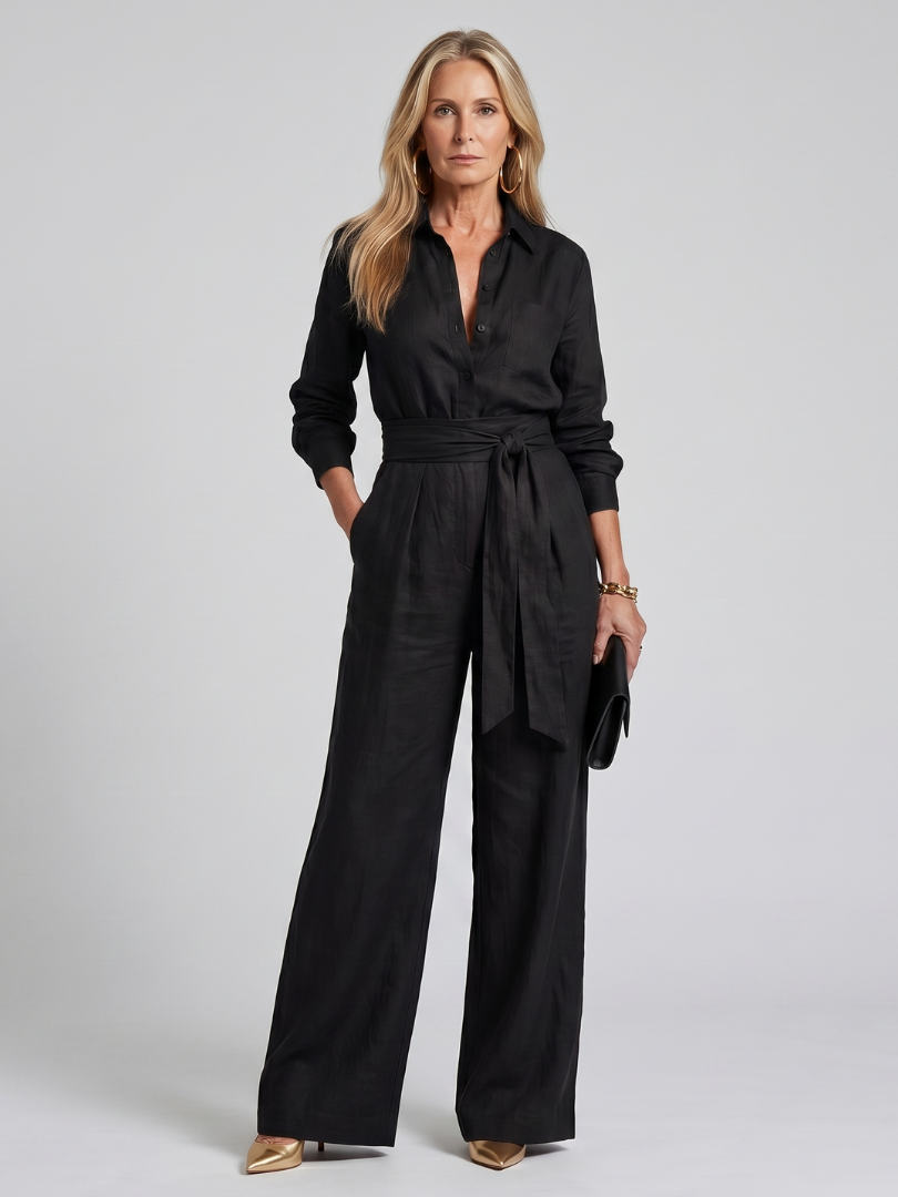 Black long-sleeve jumpsuit with a wide-leg design, offering a modern and comfortable fit for women. 8