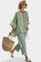 Lavender top paired with mustard striped oversized pants, creating a relaxed and chic casual outfit for women. 4