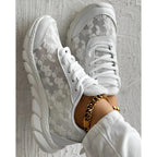 Stylish white sneakers with a minimalist design, perfect for everyday wear. 2