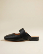 Tan chunky heel mules with a modern, minimalist design, perfect for casual or dressy occasions. 1