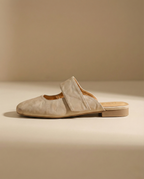 Tan chunky heel mules with a modern, minimalist design, perfect for casual or dressy occasions. 2