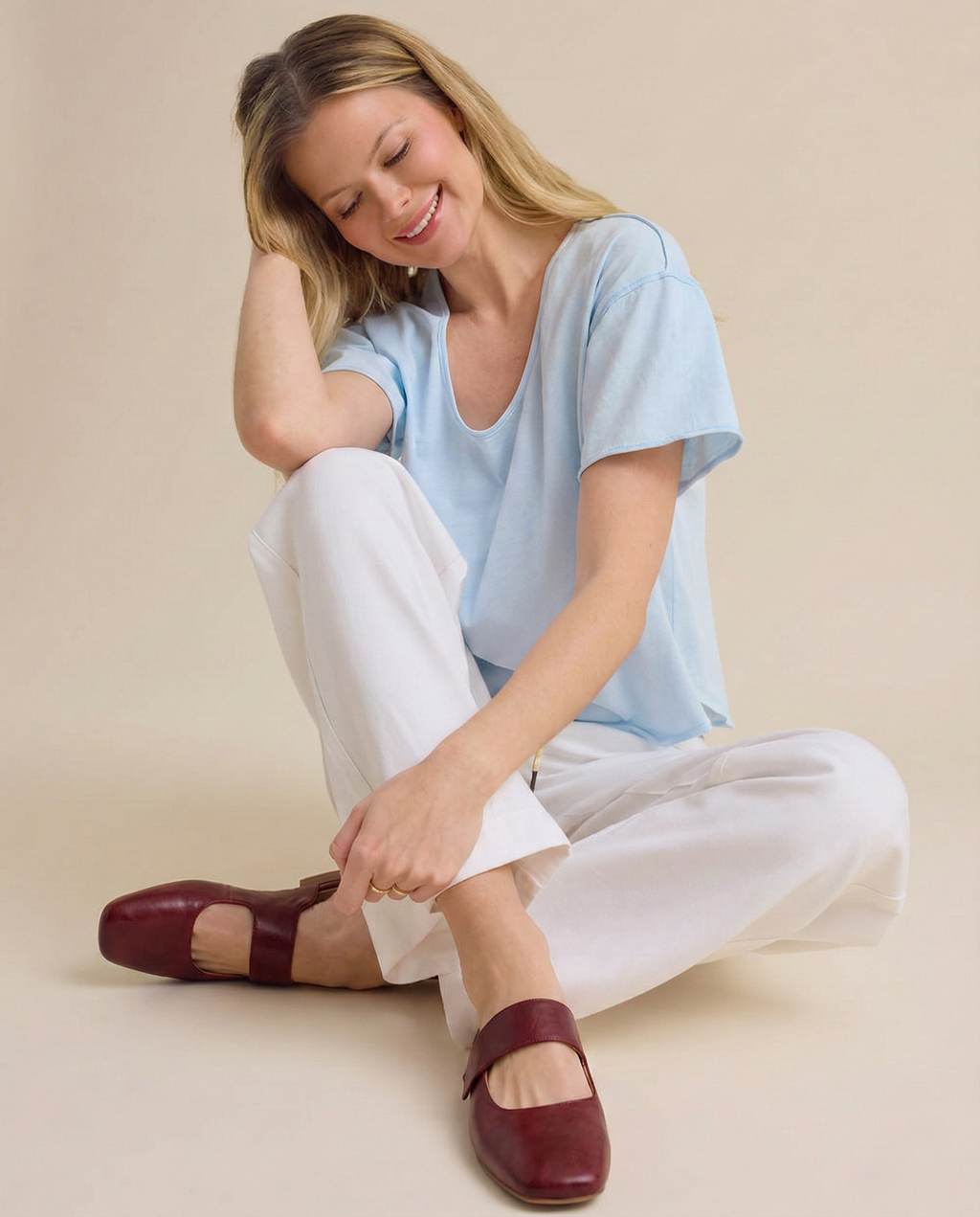 Tan chunky heel mules with a modern, minimalist design, perfect for casual or dressy occasions. 3