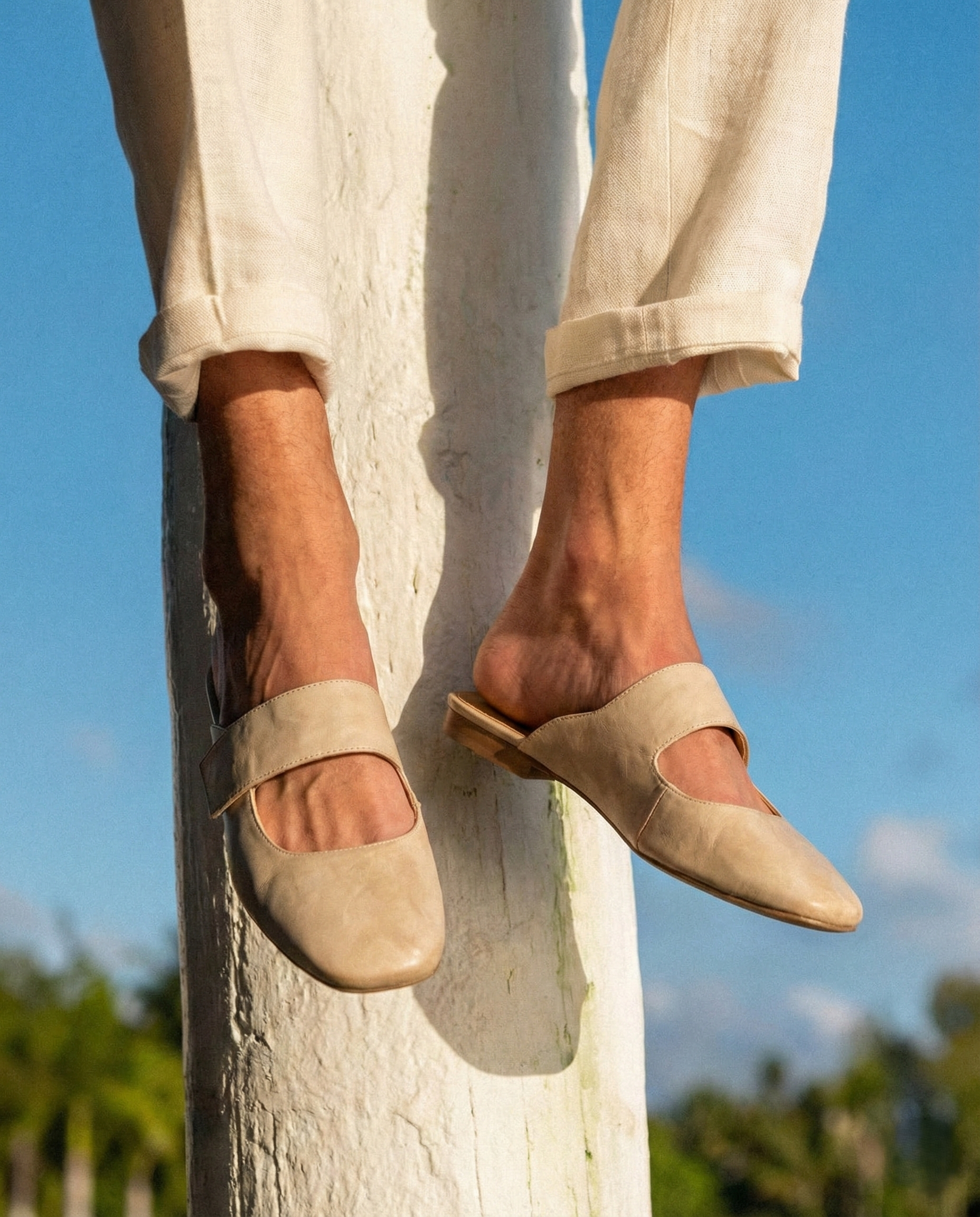 Tan chunky heel mules with a modern, minimalist design, perfect for casual or dressy occasions. 7