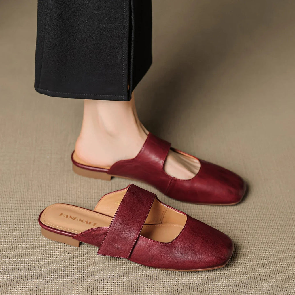 Tan chunky heel mules with a modern, minimalist design, perfect for casual or dressy occasions. 8