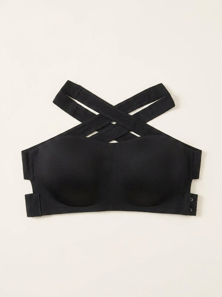 Black seamless bandeau bralette with criss cross side closure, product only flat lay
