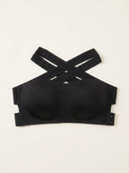 Black seamless bandeau bralette with criss cross side closure, product only flat lay
