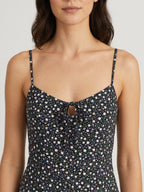 Black floral midi dress neckline close-up