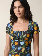 Black floral tulip print midi dress, close-up of square neckline and drawstring