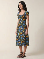 Black floral tulip print midi dress, three-quarter view