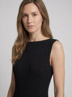 Black ribbed knit maxi dress, close-up view of boat neckline