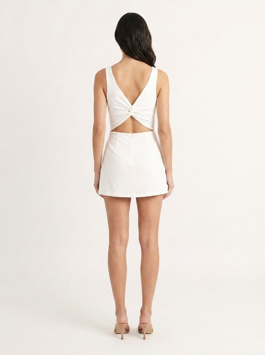 White square neck backless skort romper showing twist-back design detail, back view
