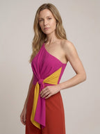 Asymmetric one-shoulder magenta jumpsuit, close-up of neckline and tie belt