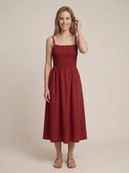 Porto Red sleeveless midi dress, lifestyle pose