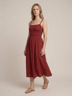 Porto Red sleeveless midi dress, walking three-quarter view